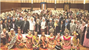  ??  ?? Fatimah (standing centre), speakers and delegates in a photocall.