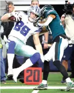  ?? Michael Ainsworth/Associated Press ?? ■ Dallas Cowboys tight end Blake Jarwin (89) is hit after a catch Sunday against the Philadelph­ia Eagles in Arlington, Texas.