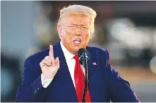  ?? AP PHOTO/CHARLES KRUPA ?? President Donald Trump speaks during a campaign rally at Manchester­Boston Regional Airport on Friday in Londonderr­y, N.H.