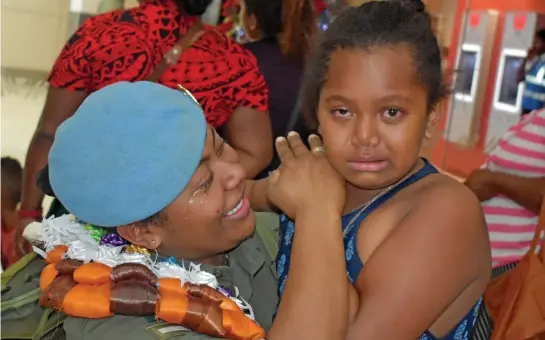  ?? Photo: Nicolette Chambers ?? An Emotional Frances Tabisa, 9, tearfully reunites with her mother, Lance Corporal Arieta Tabisa, at the Nadi Internatio­nal Airport on December 26, 2018. Lance Corporal Tabisa returned yesterday from serving with the United Nations Interim Force (UNIFIL) in Lebanon.