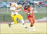  ?? RICK PECK/MCDONALD COUNTY PRESS ?? McDonald County running back Isrrael De Santiago pushes off Monett’s William Murphy on a short run during the Mustangs 21-18 win on Sept. 29 at MCHS.