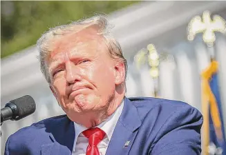  ?? Artie Walker Jr./Associated Press ?? Donald Trump pauses before ending his remarks at a rally in Summervill­e, S.C., on Monday. A New York judge ruled, Tuesday that the former president and his company committed fraud for years while building the real estate empire that catapulted him to fame and the White House.