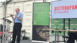  ??  ?? Councillor Peter Hughes-Griffiths speaking during a discussion at the Eisteddfod aimed towards strengthen­ing the use of Welsh within local authoritie­s.