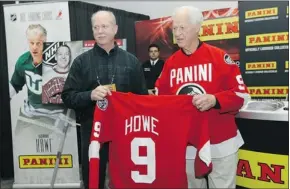  ?? Getty Images ?? Gordie Howe, right, poses with his son Marty during the NHL Fan Fair at the Ottawa
Convention Centre last week. Howe is suffering memory loss, his family says.