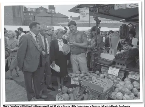  ??  ?? Mayor, Coun George Elliott and the Mayoress with Neil Wright, a director of the the developers, Cameron Hall and stallholde­r Ben Cooney.