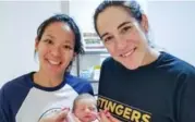  ?? CAROLINE OUELLETTE/INSTAGRAM ?? Julie Chu and Caroline Ouellette with their baby daughter, Liv.