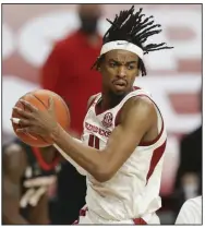  ?? (NWA Democrat-Gazette/Charlie Kaijo) ?? Senior guard Jalen Tate , who was the Horizon League defensive player of the year last season at Northern Kentucky, has been a key part of Arkansas’ success in 2020-21. Tate is averaging 11.1 points and 3.6 rebounds this season for the Razorbacks.