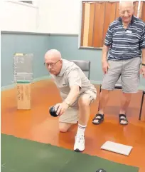  ??  ?? President Gerry about to bowl with Reg Deane watching. PHOTO: Supplied.