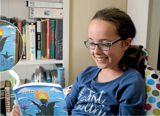  ?? ELEANOR WENMAN/STUFF ?? Ten-year-old Maia Brown has written and published her first book, Young Elements Academy. The proceeds from her book sales will be donated to Unicef.