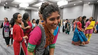  ?? Annie Mulligan / Contributo­r ?? Bhavana Gollapudi enjoys herself during dance practice at the new Gujarati Samaj event. Thousands across the city and U.S. are helping to welcome Indian Prime Minister Narendra Modi.