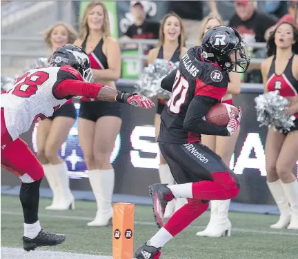  ?? WAYNE CUDDINGTON ?? Redblacks’ Chris Williams runs for one of his three touchdowns in a 26-26 tie with the Calgary Stampeders on Friday.