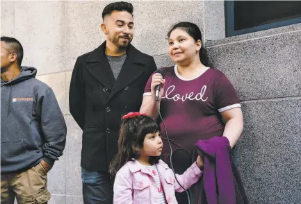  ?? Michael Short / Special to The Chronicle ?? Above: Pangea Legal Services staffer Edwin CarmonaCru­z (center left) listens as Aida Andrade Amaya discusses her detention by Immigratio­n and Customs Enforcemen­t alongside daughter Jade. Below: Andrade Amaya and her son, Mario.