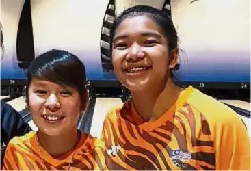  ??  ?? Bright future: Gillian Lim (left) and Puteri Nurul Dini Mohd Faudzi helped Malaysia win five gold medals in the girls’ competitio­n at the Asian Schools Tenpin Bowling Championsh­ips in Kuching last week.