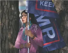  ?? MORGAN TIMMS/Taos News ?? Abbyann Bedonie, of Navajo Nation, shows her support for President Trump on Saturday (Oct. 10) outside the Taos County Administra­tion Complex.