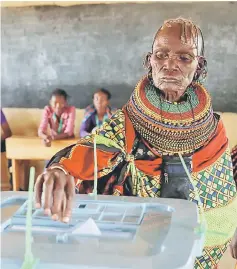  ?? — Reuters photo ?? A Turkana tribeswoma­n casts her ballot at a polling station in a village near Baragoy, Kenya.