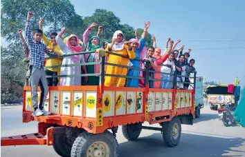  ?? — PTI ?? Women and children ride a tractor on their way to take part in farmers protest against farm laws at Singhu border in Sonipat district on Wednesday.