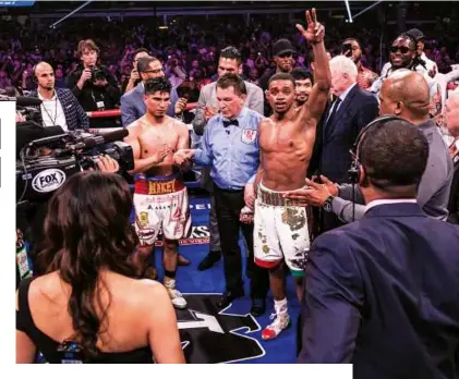  ??  ?? NICE JOB: Garcia applauds as Spence celebrates