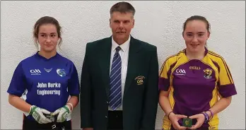  ??  ?? April Moran (right) with Una Brophy of Laois and Ricky Barron (Leinster Juvenile Chairman).