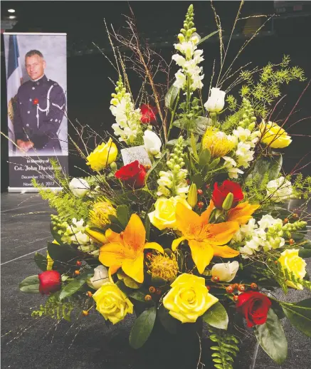  ?? ARLEN REDEKOP/PNG ?? Flowers at the funeral for Const. John Davidson, inset, in Abbotsford on Nov. 19, 2017.