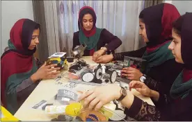  ?? AHMAD SEIR / AP ?? Teens from the Afghanista­n Robotic House practice their skills in Herat, Afghanista­n. They competed Monday in the internatio­nal competitio­n in Washington, D.C.