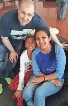  ?? HOLT FAMILY PHOTO VIA AP ?? Joshua Holt poses with his wife, Thamara, and her daughter at the airport in Caracas, Venezuela, on Saturday.