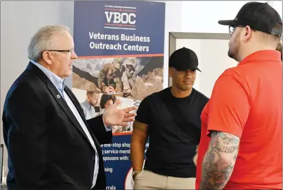  ?? CHRIS RILEY — THE REPORTER ?? Tim Murrill, director of the Solano-Napa Small Business Developmen­t Centers, talks to veterans Thursday in Fairfield.