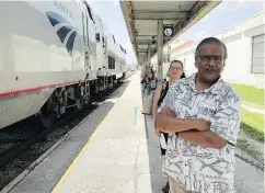  ??  ?? Jishnu Mukdrji and Penny Jacobs wait to board in Orlando, Fla. They were headed to a memorial for a member of their train group who died of a heart attack while travelling with the group. — The Associated Press