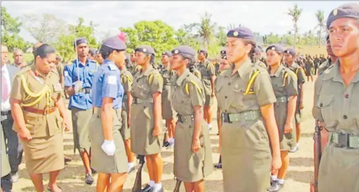  ?? Picture: SUPPLIED/FIJI ARMY ?? Colonel Litea Seruiratu (left) reviews a detachment of female cadets at Xavier College in Ba.