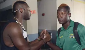  ?? JERMAINE BARNABY/FREELANCE PHOTOGRAPH­ER ?? André Russell (left) greets his new Kolkata Knight Riders teammate, Rovman Powell, on his arrival with the Jamaica Scorpions from the Regional Super50 Tournament.