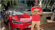  ?? PHOTO; LUZ ZUNIGA/FAIRFAX NZ ?? Darryl Naidoo proudly showed his Tesla during the Nelson stopover of the Leading the Charge convoy.