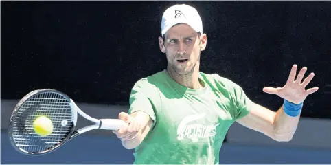  ?? AFP ?? World No.1 Novak Djokovic takes part in a practice session ahead of the Australian Open in Melbourne.