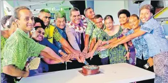  ?? Picture: VILIMAINA NAQELEVUKI ?? Assistant Minister for Youth and Sports Alipate Nagata cuts a cake with students from the University of the South Pacific’s iTaukei Students Associatio­n during their ‘tara koro’ event at the ANZ Stadium concourse at Laucala Bay, Suva on Friday.