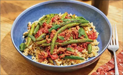  ?? TOM MCCORKLE FOR THE WASHINGTON POST ?? Blistered green beans with lamb and aromatic spices.