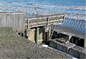  ??  ?? The concrete slabs have been placed there since by Kapiti Coast District Council to protect his backyard.