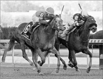  ?? BARBARA D. LIVINGSTON ?? Water White (left) wins the Busher. She makes her first start since June on Thursday.