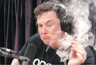  ?? JOE ROGAN EXPERIENCE/YOUTUBE ?? Tesla CEO Elon Musk smokes cannabis on The Joe Rogan Experience. He also wielded a samurai sword and a flamethrow­ner and mused on artificial intelligen­ce and the end of the world.