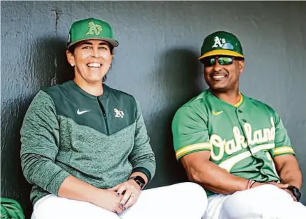  ?? Courtesy Oakland A’s ?? Veronica Alvarez, with third-base coach Eric Martins, recently was named the coordinato­r of player developmen­t in Latin America.