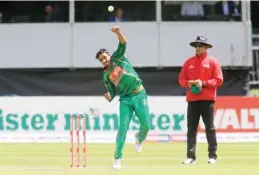  ?? —AFP ?? DUBLIN: Bangladesh’s Sunzamul Islam bowls during play in the fourth ODI match of the Ireland Tri-Nation Series between Ireland and Bangladesh at the Malahide Cricket Club.