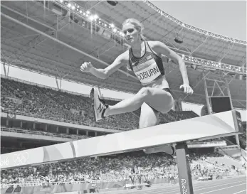  ?? KIRBY LEE, USA TODAY SPORTS ?? The USA’s Emma Coburn races to a bronze medal in the women’s 3,000-meter steeplecha­se.