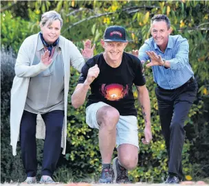  ?? PHOTO: PETER MCINTOSH ?? Getting ready . . . Dunedin ultramarat­hon runner Glenn Sutton (47, centre) prepares yesterday for his longest running challenge, Milford Sound to Mount Cook, with Otago Community Hospice chief executive Ginny Green and challenge support coordinato­r Bruce Adams.