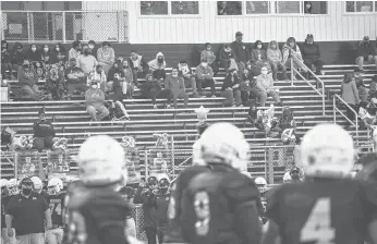  ?? SHAWNMCFAR­LAND/HARTFORD COURANT ?? Maloney and Platt High played an 11-on-11 football game against each other on Saturday, operating independen­tly from their schools. Platt played as the Westsiders, and Maloney played as the Eastsiders. 150 fans were allowed into Falcon Field in Meriden for the game.