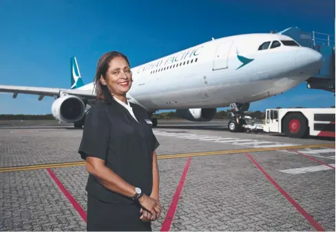  ?? Picture: BRENDAN RADKE ?? LIKE FAMILY: Cathay Pacific manager on duty Cynthia Lee has retired from Cathay Pacific after 41 years with the airline. She has spent the past 21 years working in Cairns.