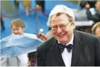  ?? AP PHOTO/MISHA JAPARIDZE ?? Film director Alan Parker arrives at the opening ceremony of 26th Moscow Internatio­nal Film Festival in Moscow on June 18, 2004. Parker has died at 76 after a long illness, according to his family.