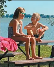  ?? Kristine Moninger ?? Sister and brother Keeley, left, and Kane Moninger enjoy time by the lake this summer. Because of COVID-19 restrictio­ns, Mom Kristine said the family did more outdoor activities such as camping and boating.