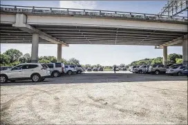  ?? RICARDO BRAZZIELL / AMERICAN-STATESMAN ?? The Stratford project will aim to stabilize the ground by laying gravel over a portion of the field. It will also improve drainage in the area in hopes of keeping water from stagnating on Stratford Drive.