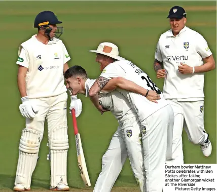  ?? ?? Durham bowler Matthew Potts celebrates with Ben Stokes after taking another Glamorgan wicket at The Riverside
Picture: Getty Images