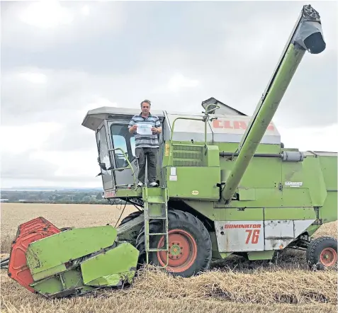  ?? ?? Neil Parish posted this picture of himself on a Dominator on social media during the 2020 24 Hours in Farming campaign, which showcased what farmers do in a typical working day