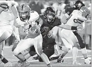  ?? Special to the Democrat-Gazette/JIMMY JONES ?? Joe T. Robinson defensive tackle Brayden Fitts (right) sacks Mena quarterbac­k Zane Stephens on Friday at Charlie George Stadium in Little Rock.