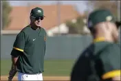  ?? DARRON CUMMINGS — THE ASSOCIATED PRESS ?? Oakland Athletics manager Bob Melvin watches as players run the bases during spring training baseball practice on Feb. 20 in Mesa, Ariz.