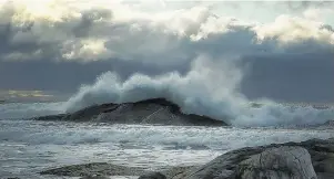  ??  ?? When there is an off shore storm passing, Bernice MacDonald leaves her home in Antigonish, N.S., and heads to Tor Bay. That’s what she did last Saturday morning. She says the wind and waves were spectacula­r thanks to post tropical storm Michael!